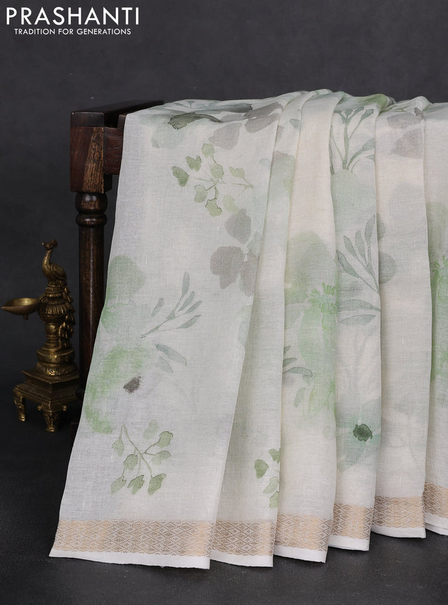 Pure linen saree cream and light green with allover flower prints and zari woven border