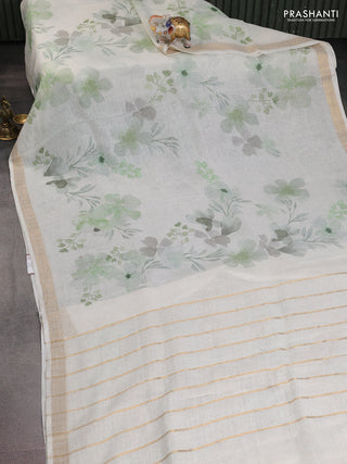 Pure linen saree cream and light green with allover flower prints and zari woven border