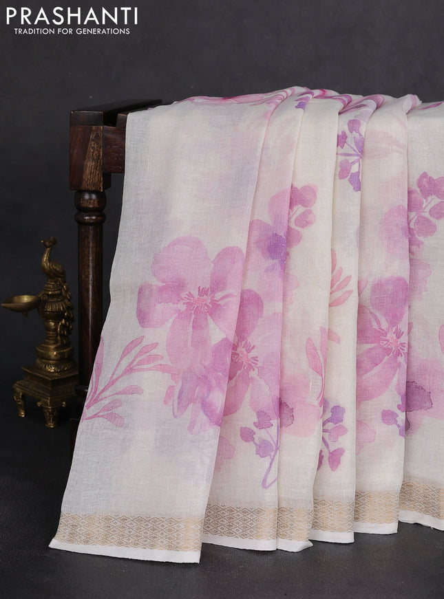 Pure linen saree cream and mild lavender with allover flower prints and zari woven border