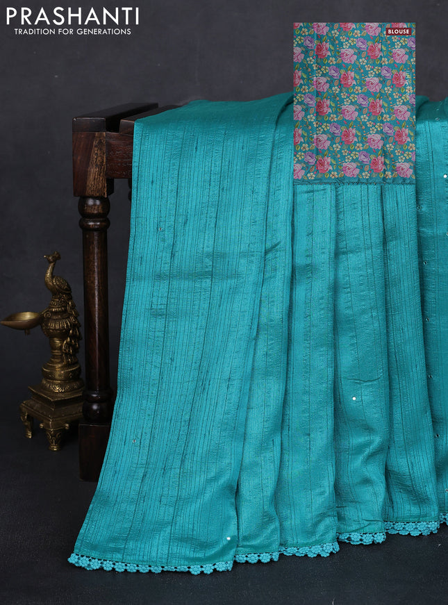 Semi raw silk saree teal blue with allover mirror work and lace work border