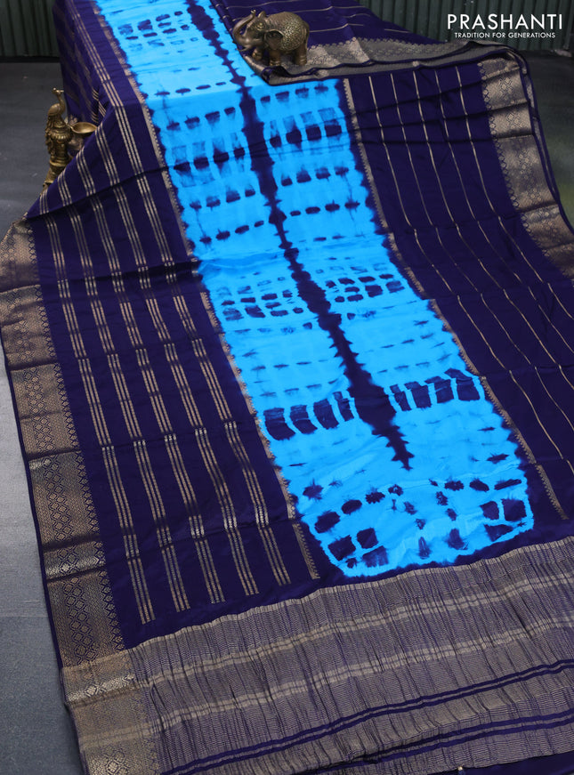 Semi crepe saree cs blue and blue with allover tie & dye prints and long zari woven border