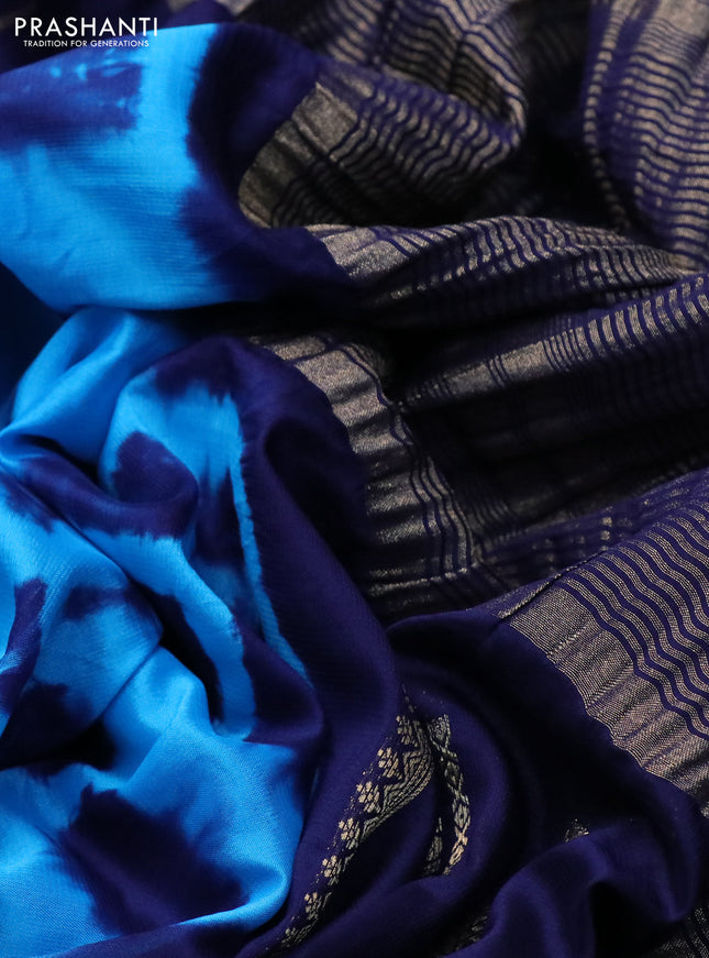 Semi crepe saree cs blue and blue with allover tie & dye prints and long zari woven border