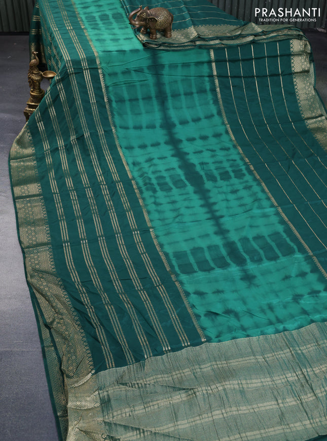 Semi crepe saree green with allover tie & dye prints and long zari woven border