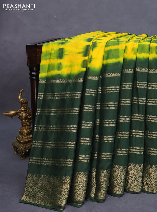Semi crepe saree yellow and green with allover tie & dye prints and long zari woven border