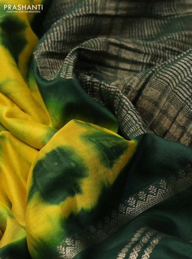 Semi crepe saree yellow and green with allover tie & dye prints and long zari woven border