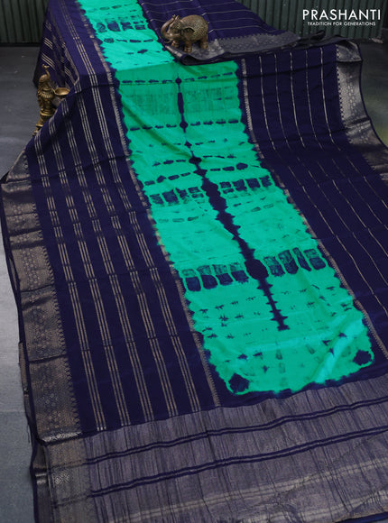 Semi crepe saree teal green and navy blue with allover tie & dye prints and long zari woven border