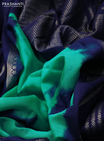 Semi crepe saree teal green and navy blue with allover tie & dye prints and long zari woven border