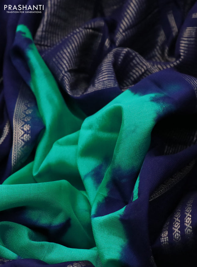 Semi crepe saree teal green and navy blue with allover tie & dye prints and long zari woven border