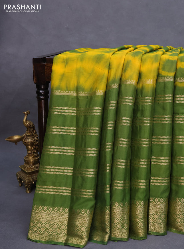 Semi crepe saree yellow and green with allover tie & dye prints and long zari woven border