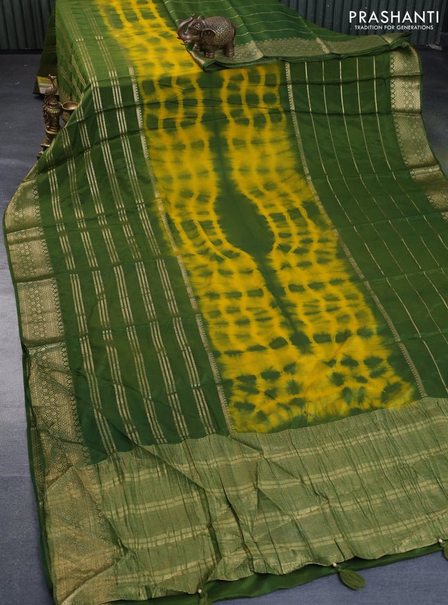 Semi crepe saree yellow and green with allover tie & dye prints and long zari woven border