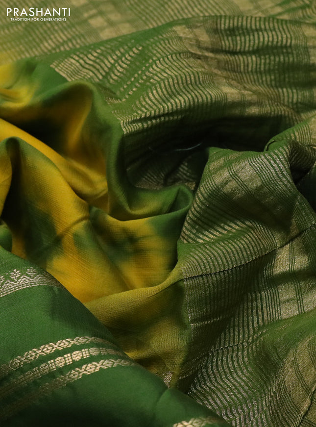 Semi crepe saree yellow and green with allover tie & dye prints and long zari woven border