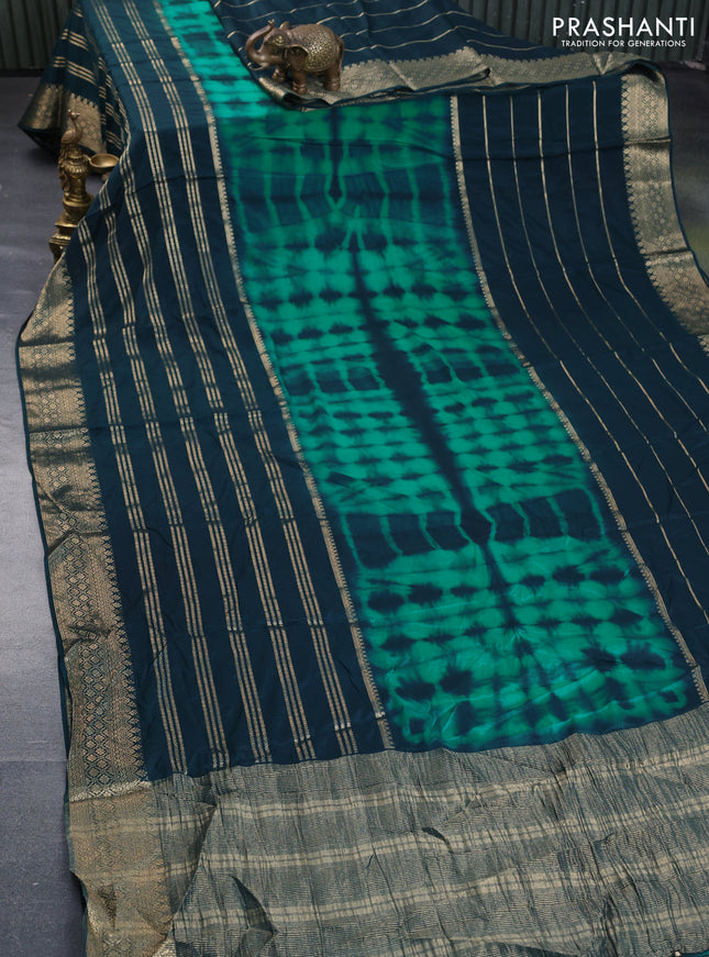 Semi crepe saree teal green and peacock green with allover tie & dye prints and long zari woven border
