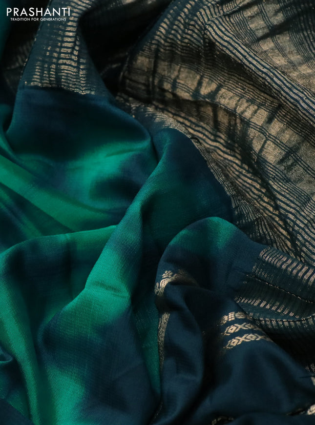 Semi crepe saree teal green and peacock green with allover tie & dye prints and long zari woven border