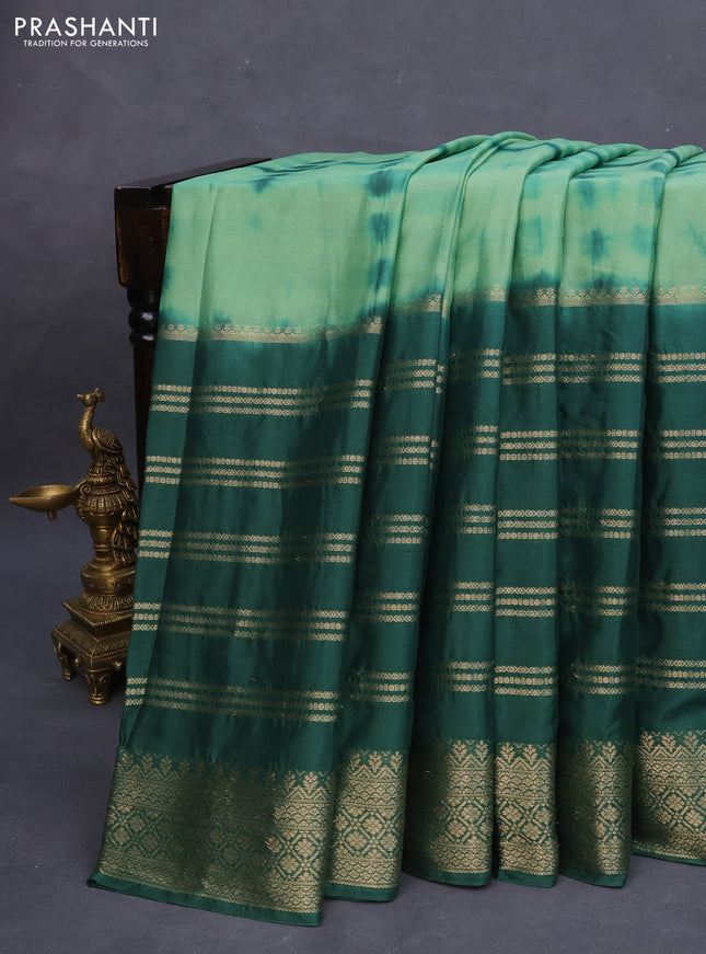 Semi crepe saree pastel green and dark green with allover tie & dye prints and long zari woven border