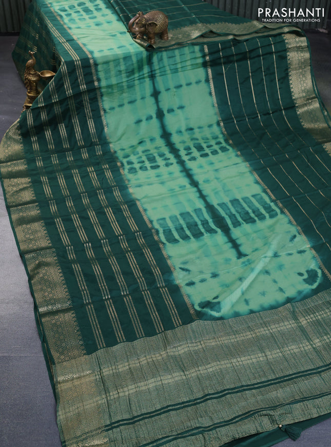 Semi crepe saree pastel green and dark green with allover tie & dye prints and long zari woven border