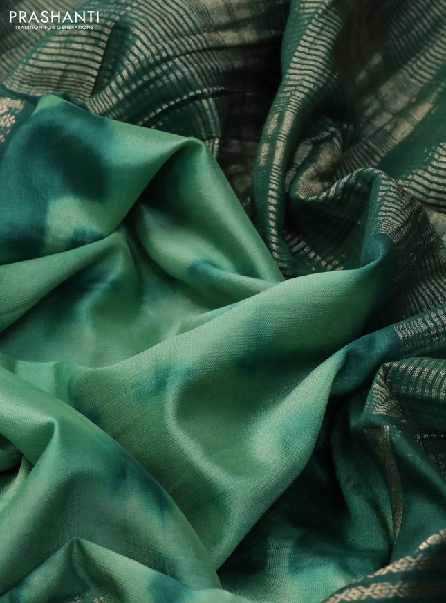 Semi crepe saree pastel green and dark green with allover tie & dye prints and long zari woven border