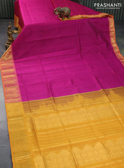 Silk cotton saree magenta pink and mustard yellow with plain body and temple design zari woven border