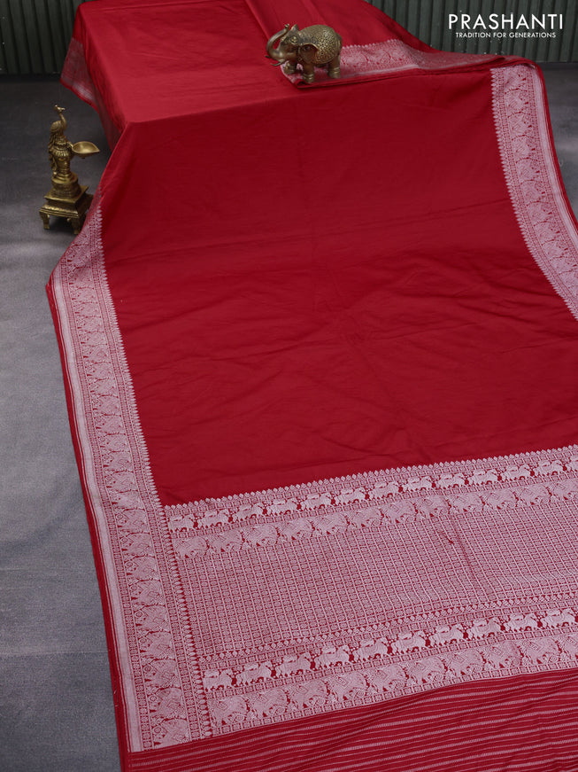 Banarasi crush crepe saree red with plain body and silver zari woven elephant border