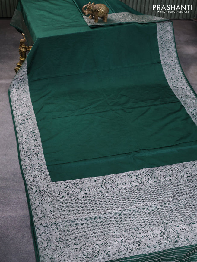 Banarasi crush crepe saree dark green with plain body and silver zari woven border