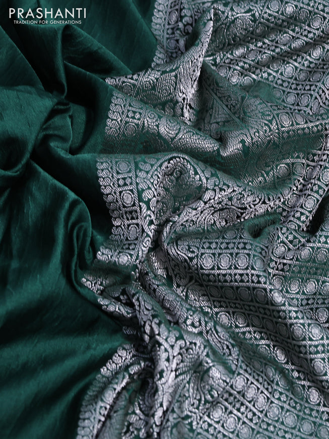 Banarasi crush crepe saree dark green with plain body and silver zari woven border