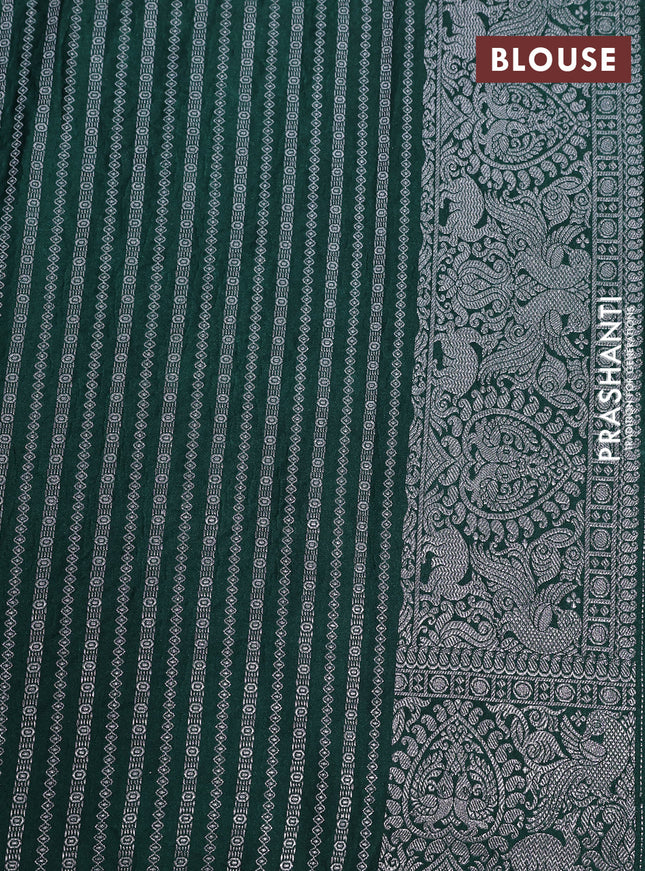 Banarasi crush crepe saree dark green with plain body and silver zari woven border
