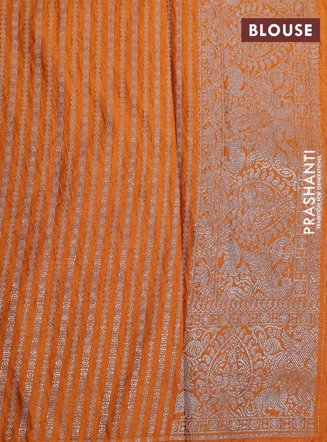 Banarasi crush crepe saree mustard yellow with plain body and silver zari woven border