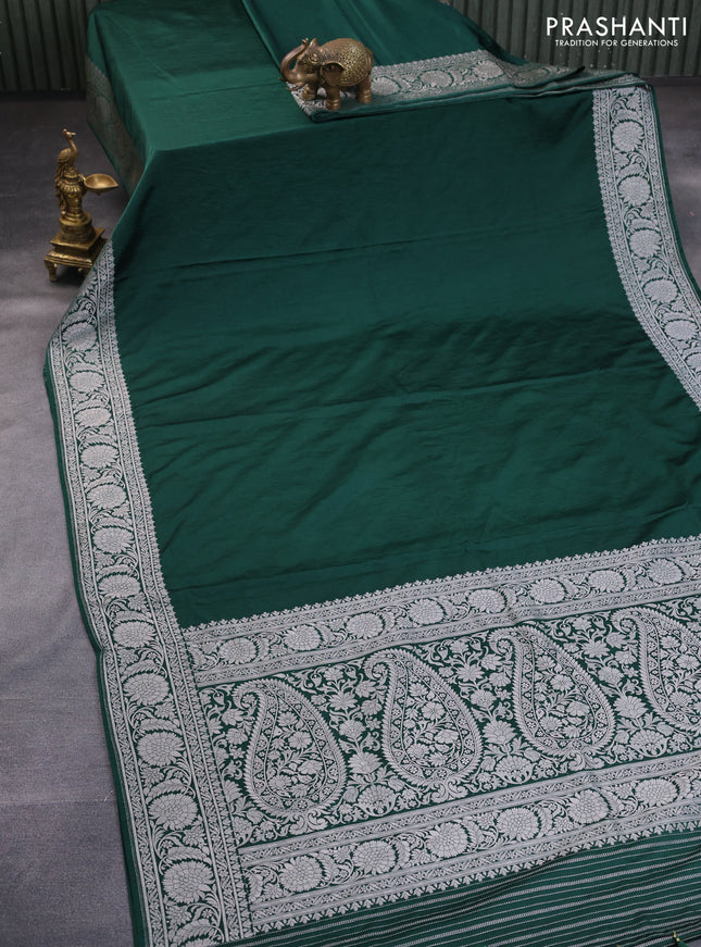 Banarasi crush crepe saree dark green with plain body and silver zari woven floral border