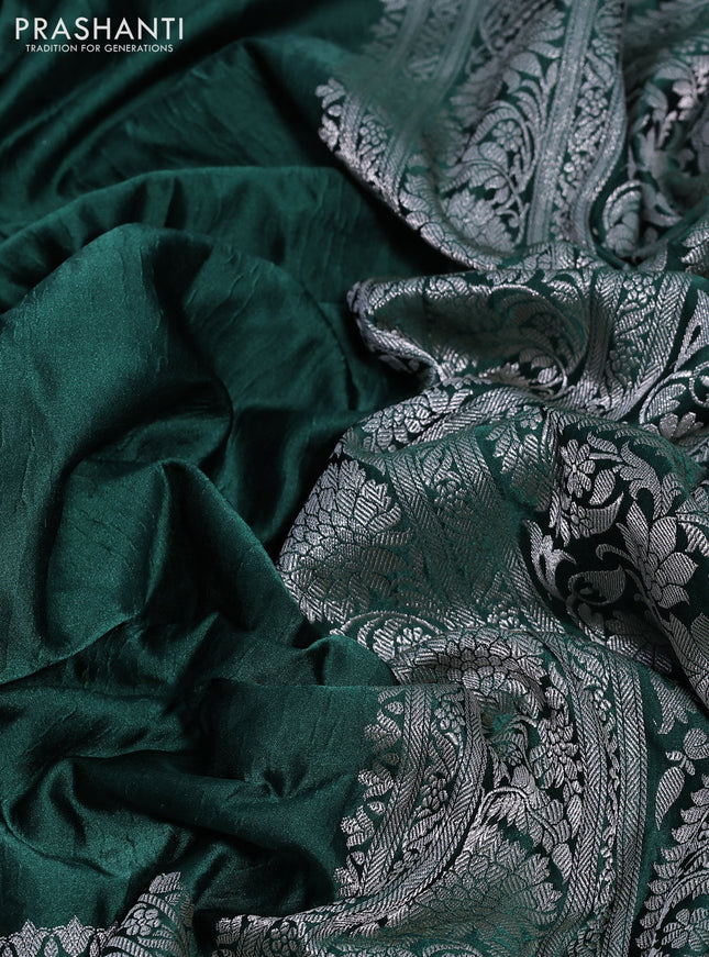 Banarasi crush crepe saree dark green with plain body and silver zari woven floral border