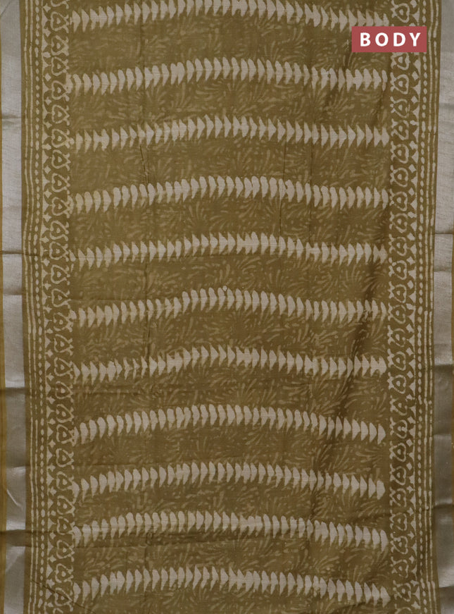 Linen cotton saree elaichi green and beige with allover prints and silver zari woven border