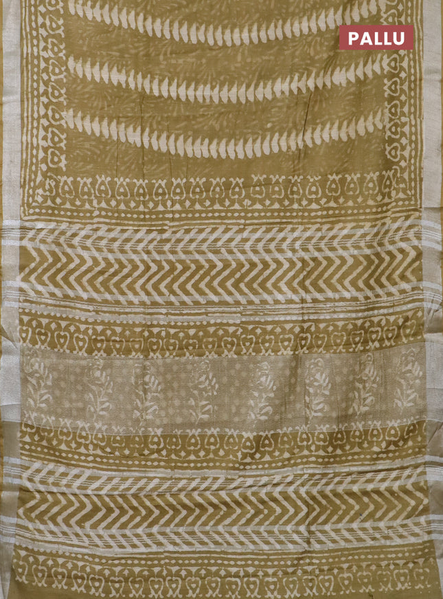 Linen cotton saree elaichi green and beige with allover prints and silver zari woven border
