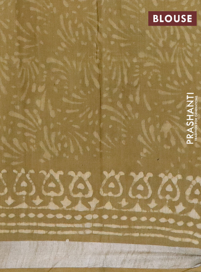 Linen cotton saree elaichi green and beige with allover prints and silver zari woven border