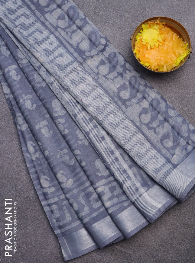 Linen cotton saree grey with allover dabu prints and silver zari woven border