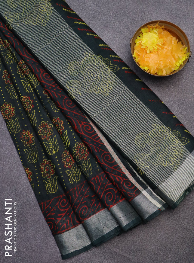 Linen cotton saree bottle green with allover floral butta prints and silver zari woven border