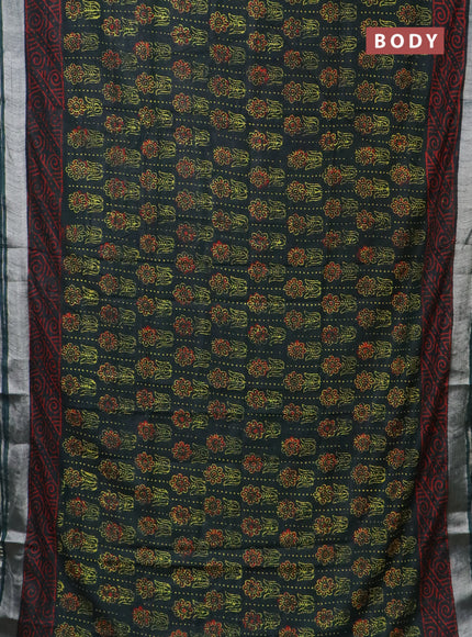 Linen cotton saree bottle green with allover floral butta prints and silver zari woven border