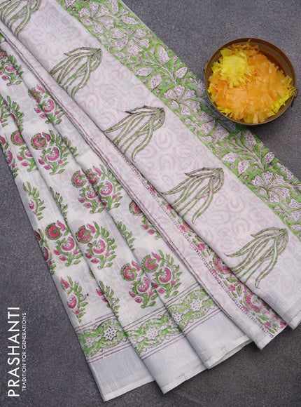 Linen cotton saree off white and green with allover butta prints and silver zari woven border