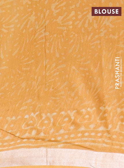 Linen cotton saree mustard yellow with dabu prints and silver zari woven border