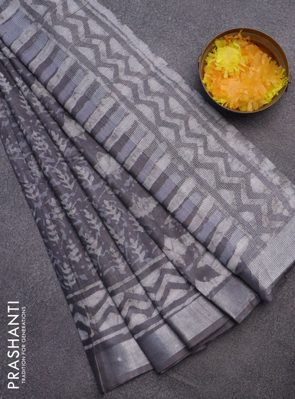 Linen cotton saree grey with allover dabu prints and silver zari woven border
