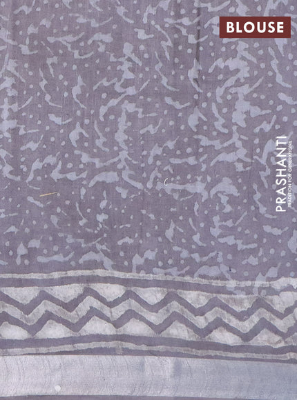 Linen cotton saree grey with allover dabu prints and silver zari woven border