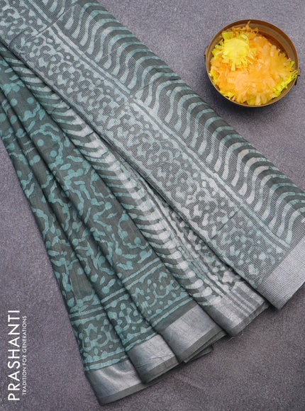 Linen cotton saree greyish green with allover batik prints and silver zari woven border