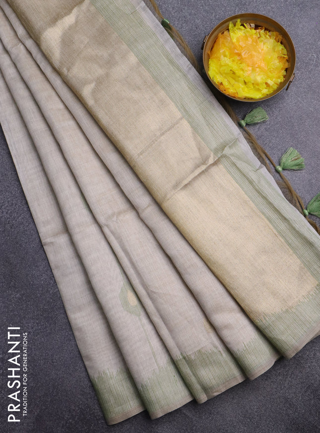 Munga cotton saree cream and green with thread & zari woven buttas and thread woven border