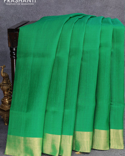 Pure raw silk saree green and magenta pink with plain body and ikat woven pallu