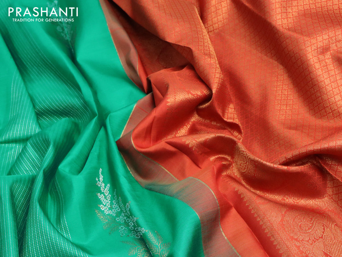 Pure kanjivaram silk saree teal green and rustic orange with allover zari weaves & buttas in borderless style