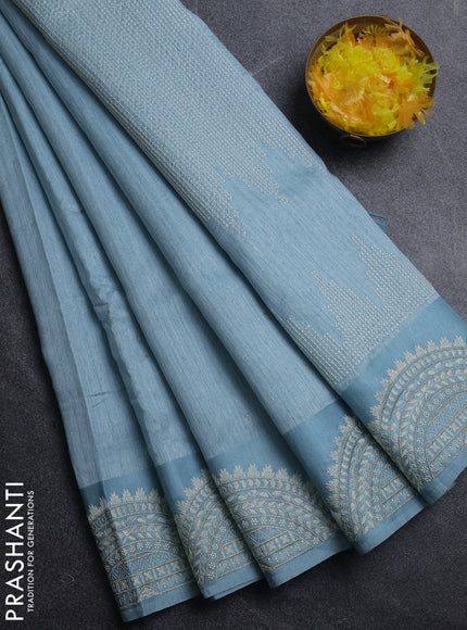 Jute silk saree pastel blue with embroidery buttas and embroidery border