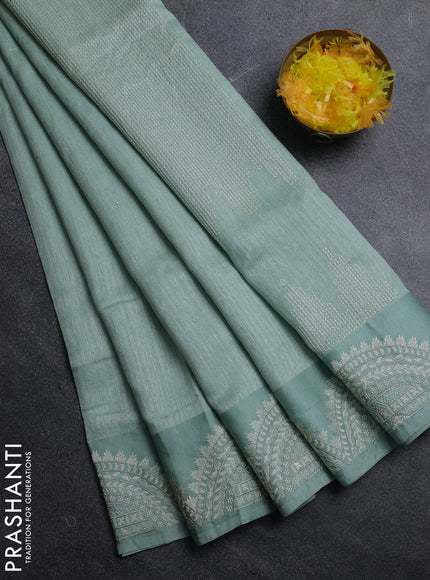 Jute silk saree pastel green with embroidery buttas and embroidery border