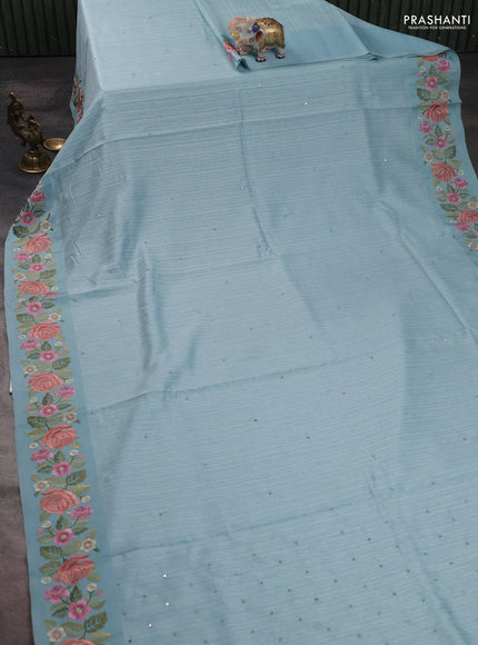 Jute silk saree pastel blue with embroidery buttas and floral embroidery butta border