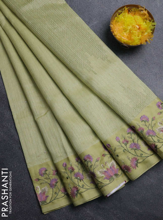 Jute silk saree pista green with embroidery buttas and embroidery border
