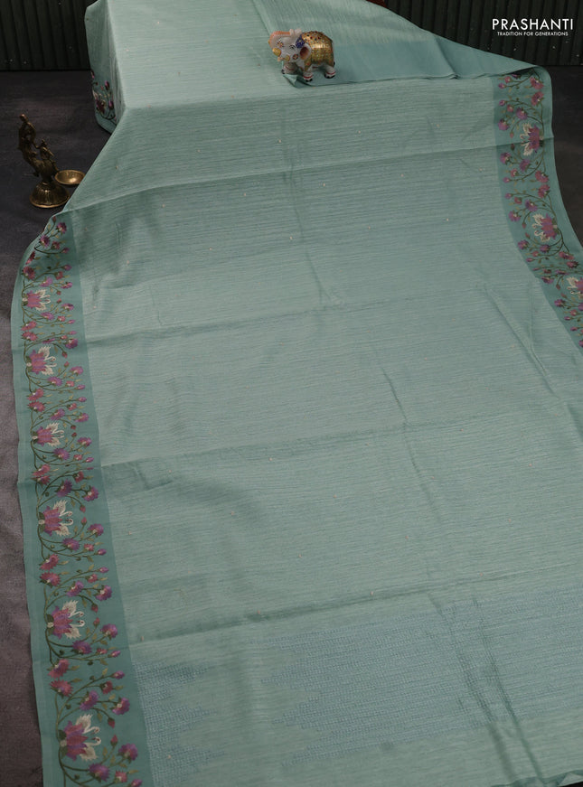 Jute silk saree pastel green with embroidery buttas and embroidery border