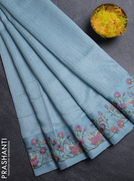 Jute silk saree pastel blue with embroidery buttas and embroidery border