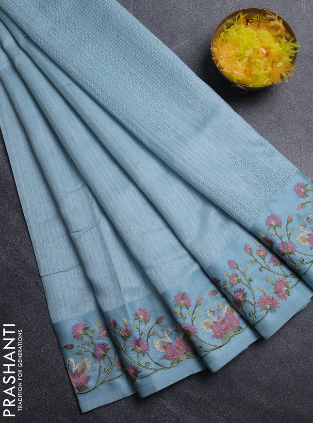 Jute silk saree pastel blue with embroidery buttas and embroidery border