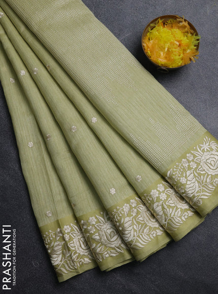 Jute silk saree pista green with embroidery buttas and parsi embroidery border